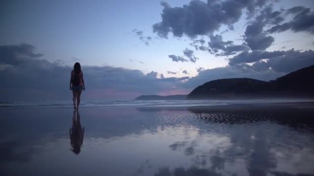 alone girl walking on beach
